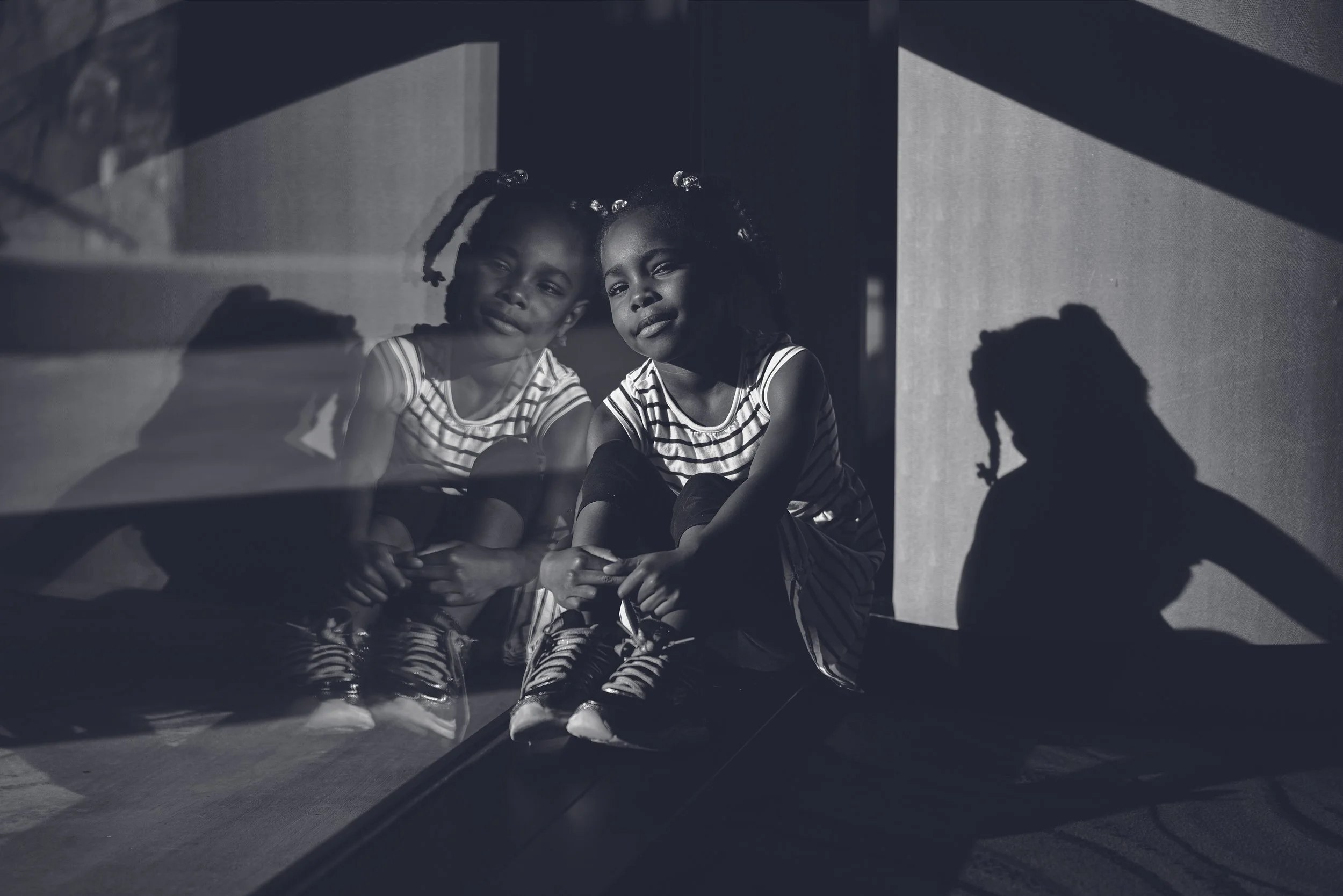 Black and White Children’s Portrait with Reflection and Shadow Play