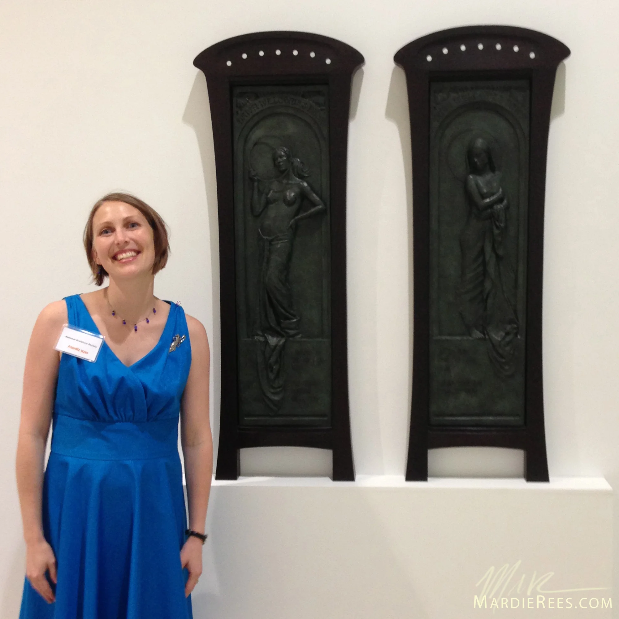 Mardie Rees standing next to "Dawn & Dusk" on the night of the opening reception. 