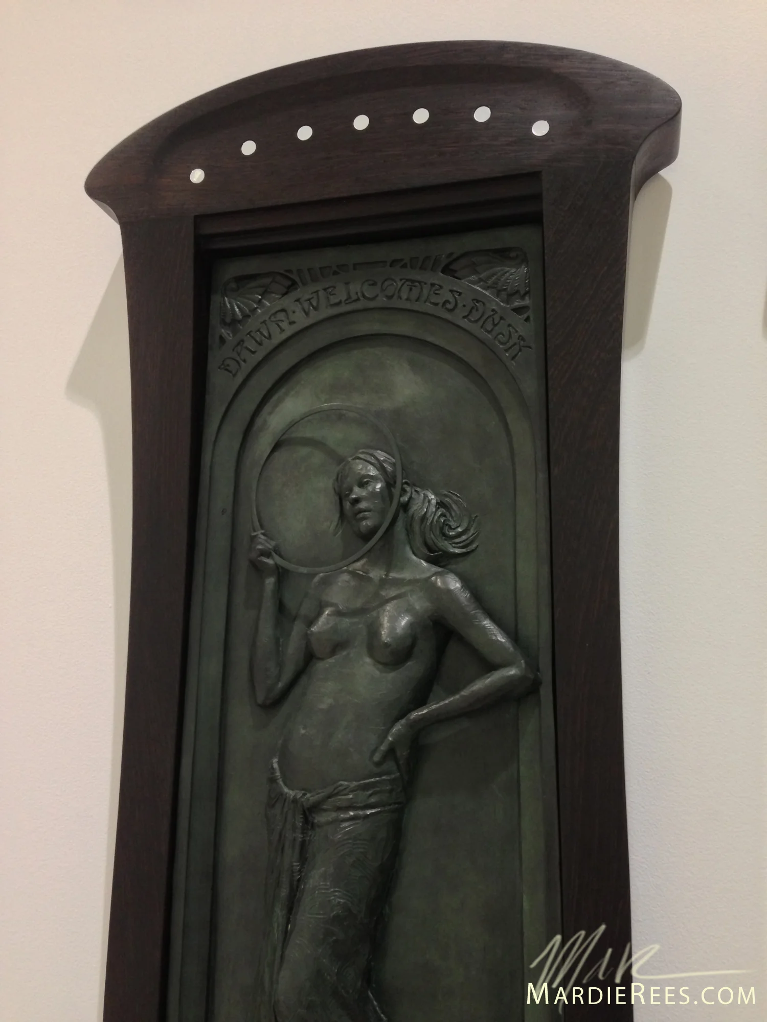 Detail of the ring Dawn is holding and the art nouveau frame. 