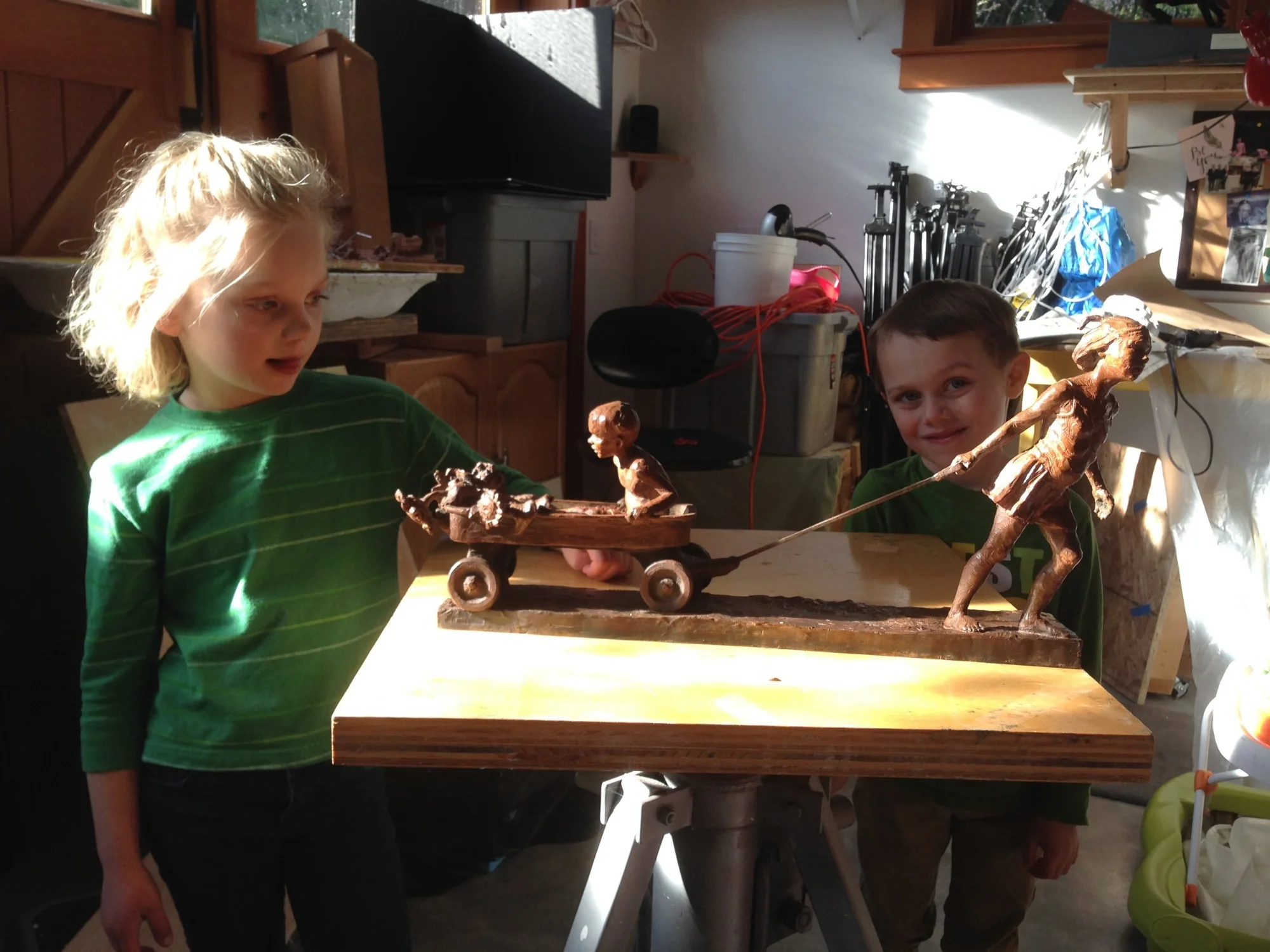 My kids, Jasmine and Adam, taking a closer look at the finished bronze sculpture. 