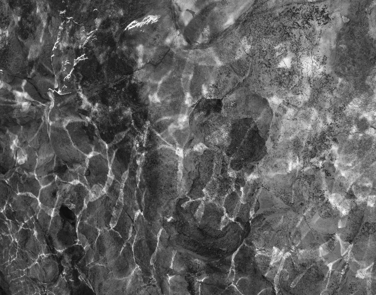 A variation on the reflection theme taken from the water. Reflections onto rock face. Something I couldn't have done with a big heavy DSLR - holding the camera above water while swimming out to a vantage point then holding the camera still enough with one hand to take the shot. I could make EVF adjustments with one hand also.