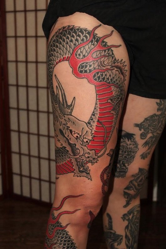 Tattoo uploaded by Brennantattoo  Sunday session red  Black dragon and  flowers tattoo  Tattoodo