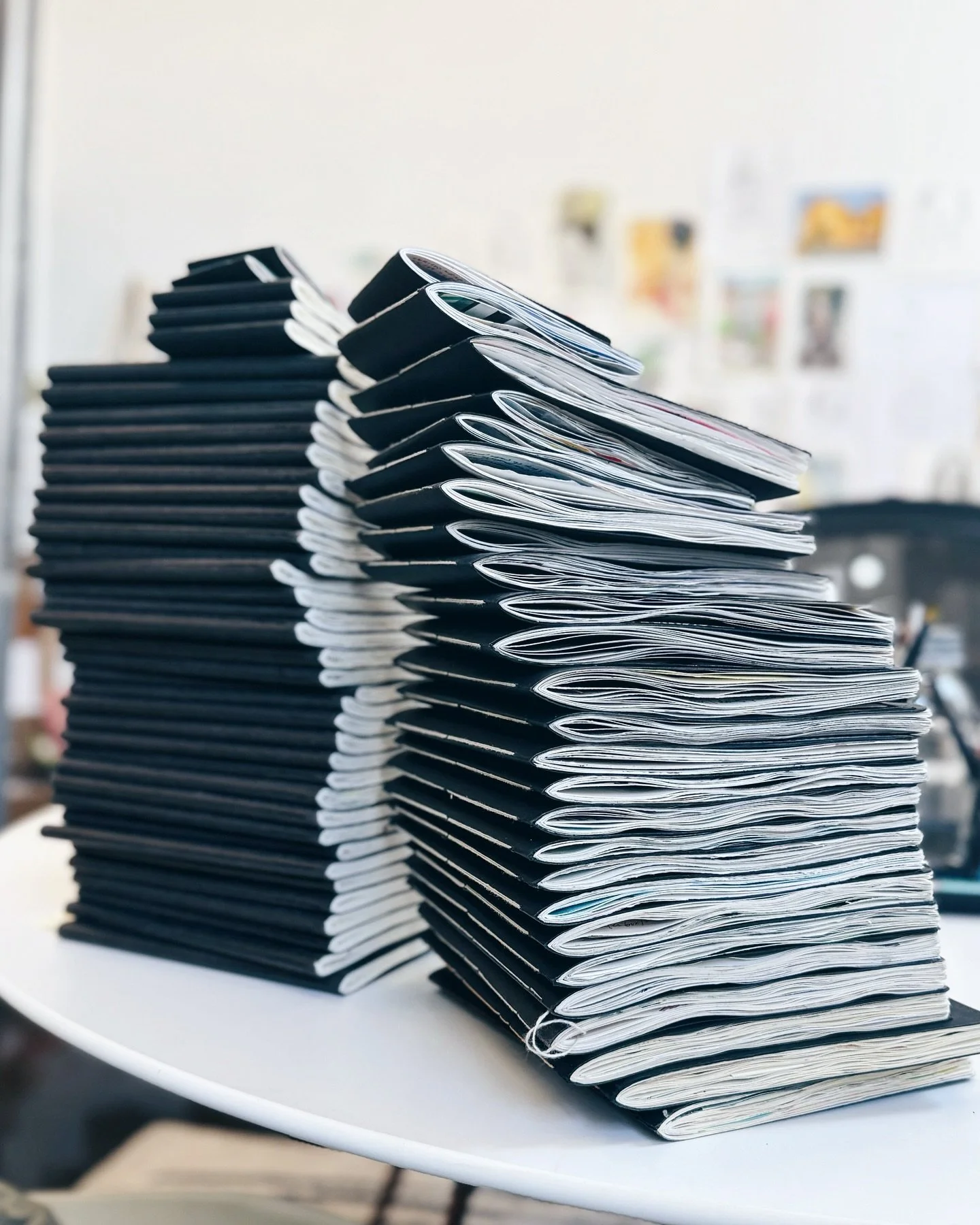 Current stack of sketchbooks (plus some older images of the stacks through the years), and an endless stack of stories. So much change lives in these pages. 

Felt like a good time to pull them all out and take a photo, though at this point I can&rsq