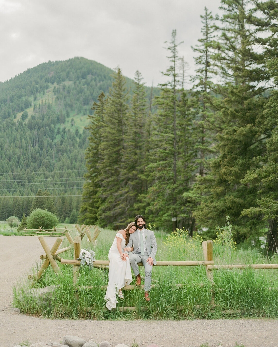 We traveled down the mountain road between their ceremony and reception from Big Sky to Bozeman stopping all along the way for breathtaking views like this with the newlywed pair. James and Gabbi&rsquo;s wedding day turned family vacation was like a 