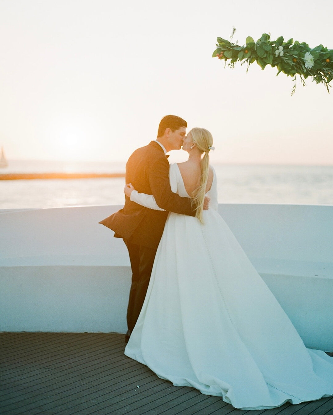 Taylor and Jake had the most breathtaking open seas sunset for their Yacht Starship wedding day. 🤍