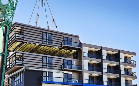 A Prefab module being installed. Image via Hickory Group