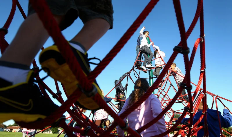  Founders Elementary students play on the new playground added during summer renovations before the first day of school in DeKalb, Ill. on Tuesday, Sept. 6, 2011. 