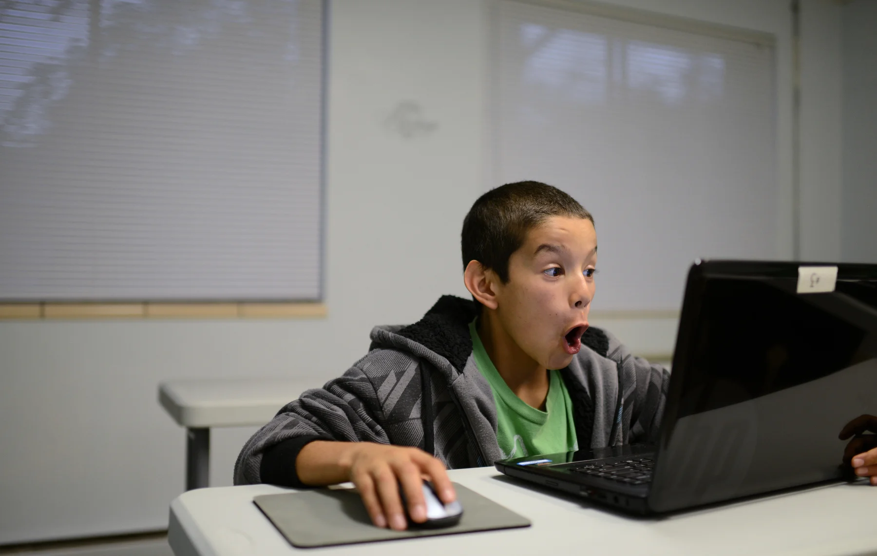  Tony Rivera reacts to a video about ghosts on YouTube while using a laptop in the training room at Freedom House, where he lives, in Green Bay, Wis. on Monday, Sept. 22, 2014.&nbsp; 