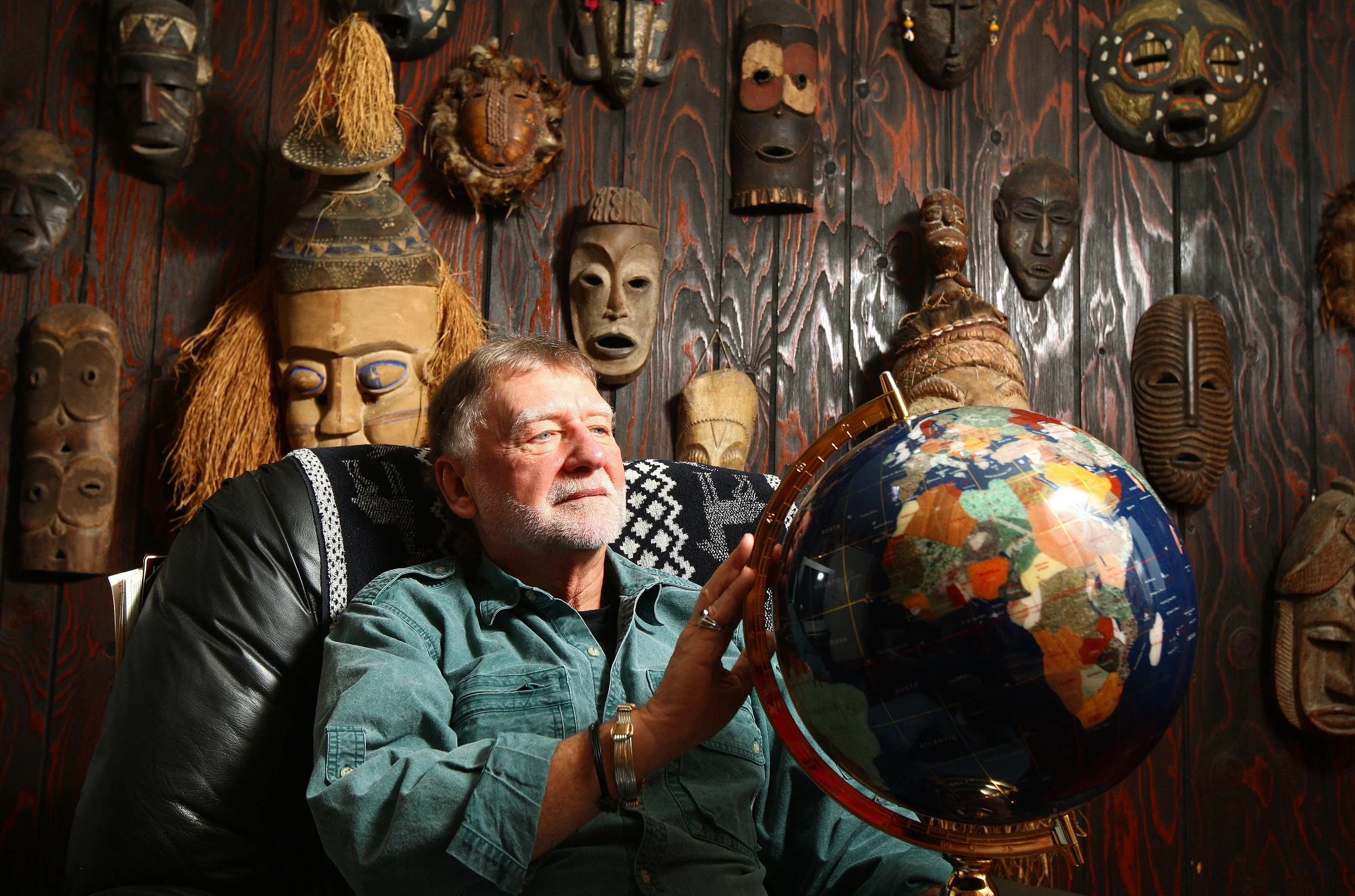   Dr. Leonard Kouba, a retired Northern Illinois geography professor, has traveled all over the world hunting and fishing and setting records along the way. Kouba is pictured in one of the rooms in his Sycamore home that has a collection of African m