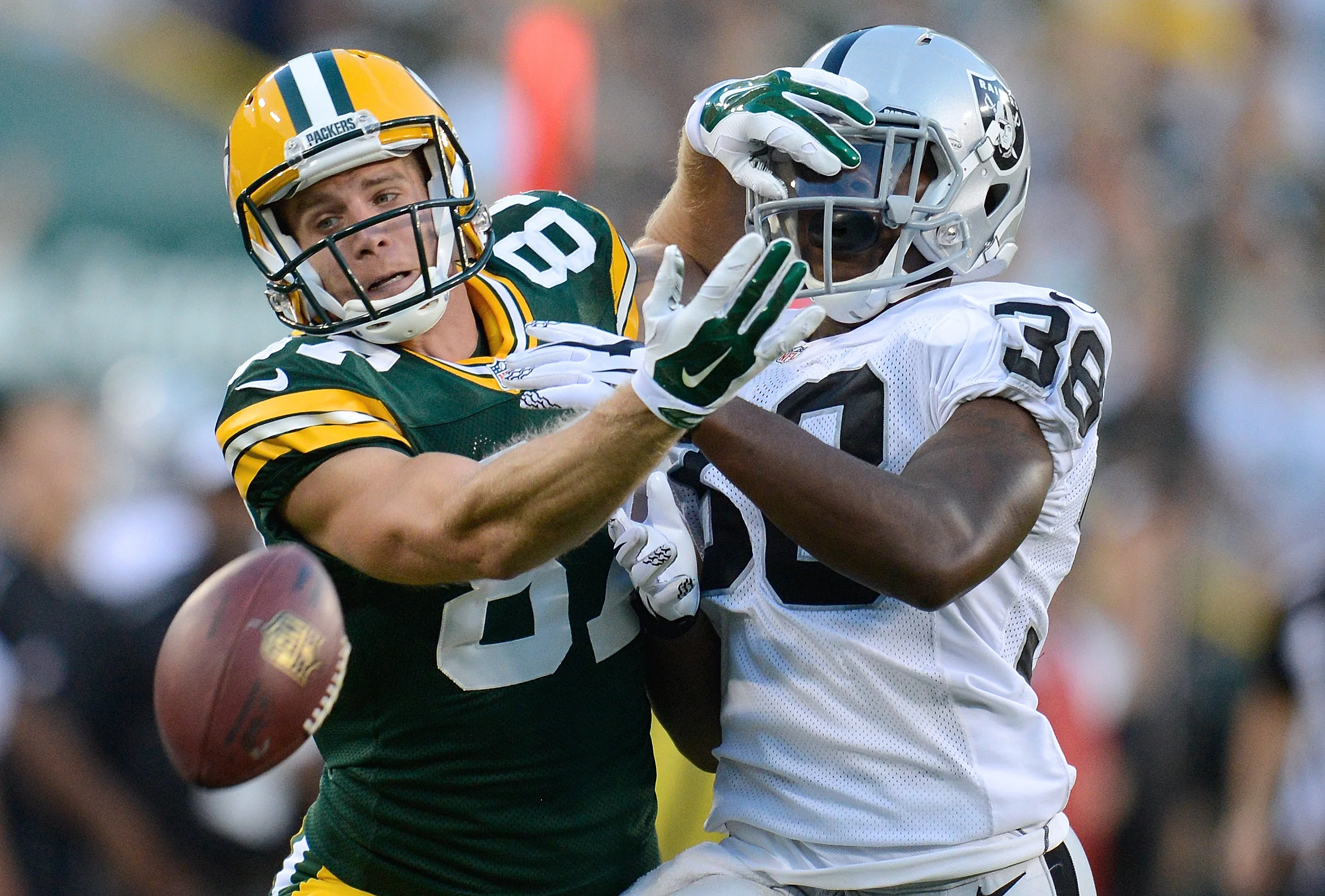 Green Bay Packers receiver Jordy Nelson battles Oakland Raiders safety Jeremy Deering in an exhibition game at Lambeau Field in Green Bay, Wis. on Friday, Aug. 22, 2014. Kyle Bursaw / Press-Gazette Media