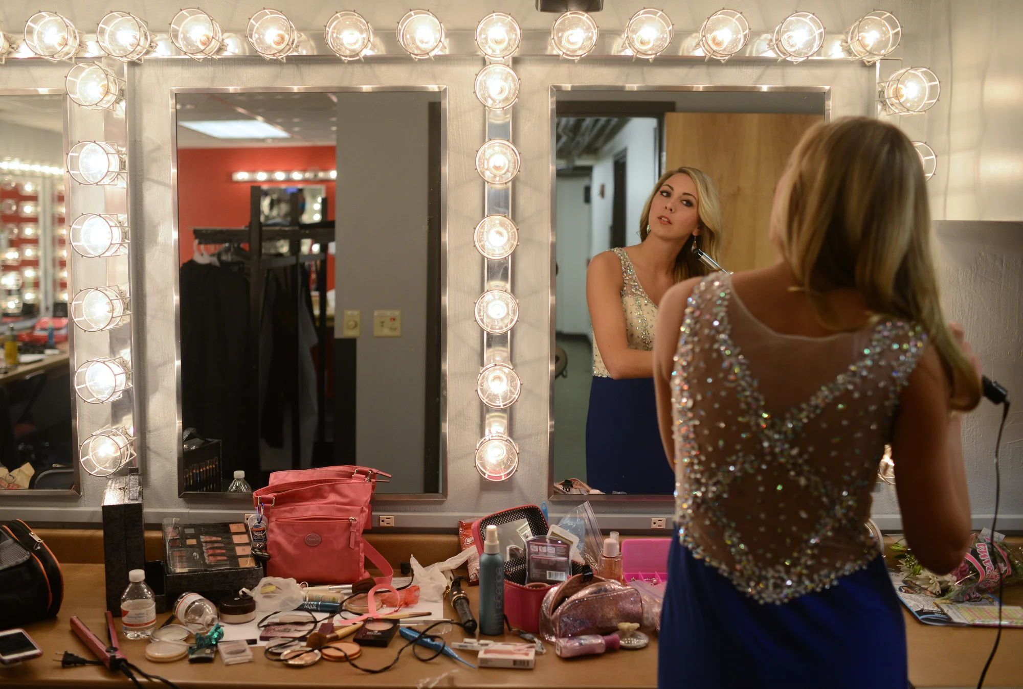  Miss Green Bay Area 2015 contestant Jennie Collins does her hair at intermission at the Meyer Theatre in Green Bay, Wis. on Saturday, Jan. 24, 2015.&nbsp; 
