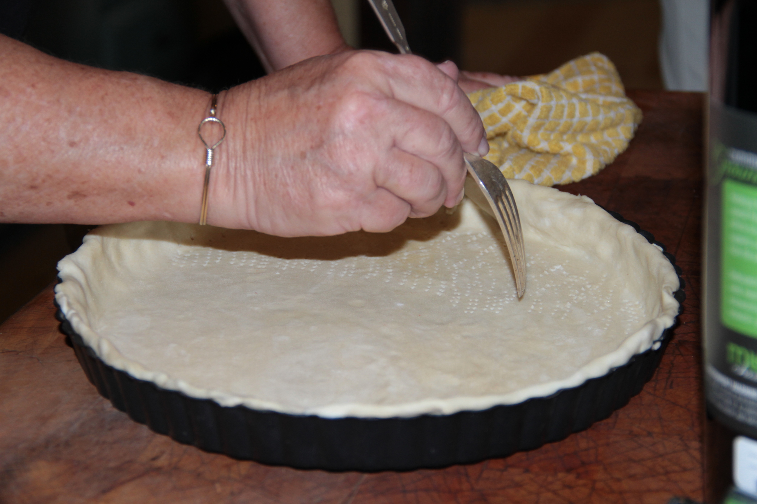  Docking the dough prior to baking to allow air to escape 