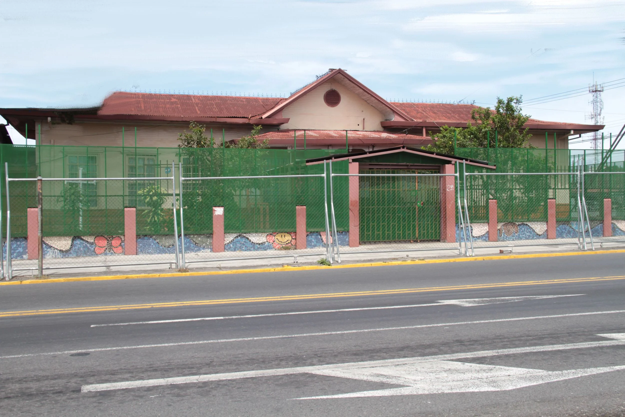  Many of the family attended this school in Cinco Esquinas (near San Jose). &nbsp;The fence was added to keep the kids from accidentally running out into the very busy street. 