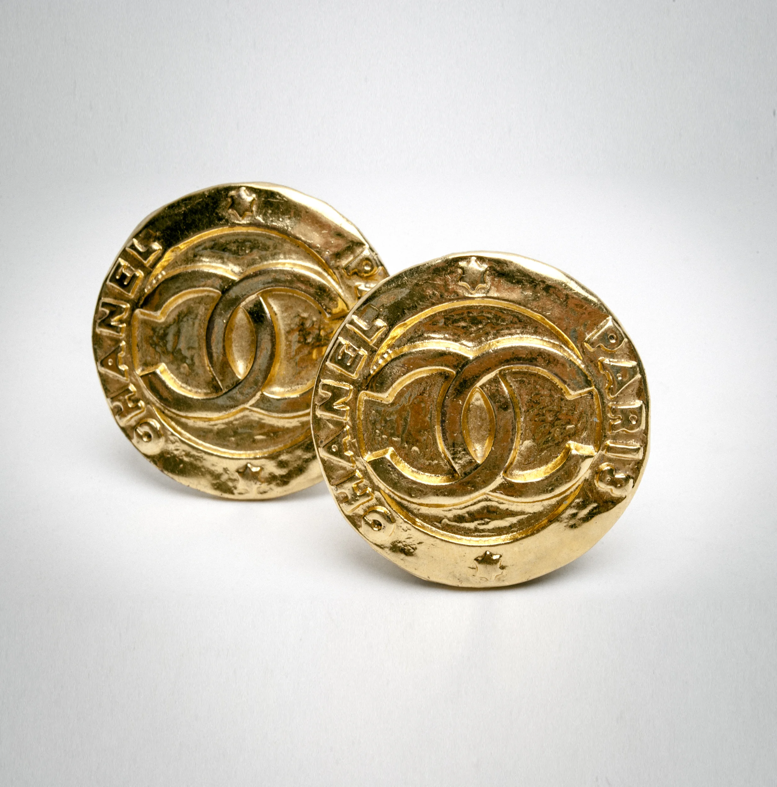 Gold circle earrings with Chanel logo