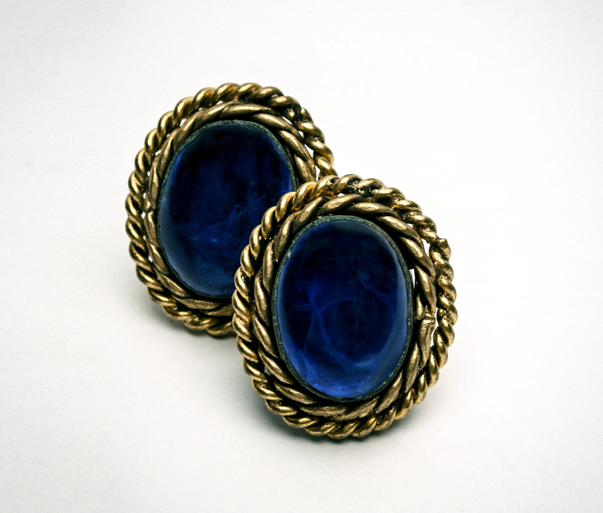 Pair of vintage blue and gold oval earrings with rope-like border