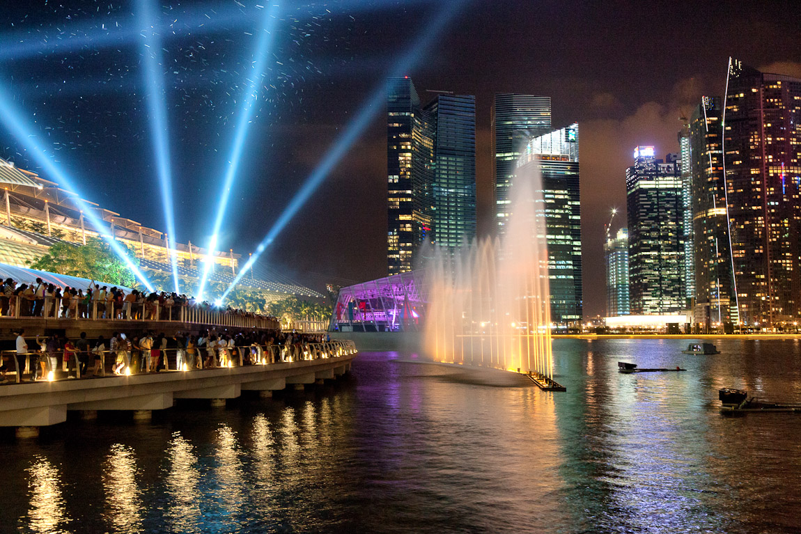 I hear the deep sound of the music for the light show at the Marina Bay Sands every night at 8 PM but hadn't manage to photograph it from the boardwalk until recently. Here is an image from last night--the particles in the air near the laser lights are bubbles (also on Google+).