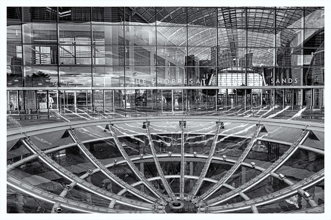 It rained over night which cleared the air and made it feel a bit fresher than normal this morning around Marina Bay in Singapore. Attached is an HDR image, converted to black & white of The Shoppes at Marina Bay Sands.