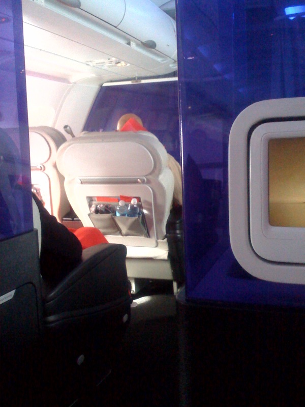 The view of first class on Virgin America, from the medium-priced seats. Air travel is super-glamorous.