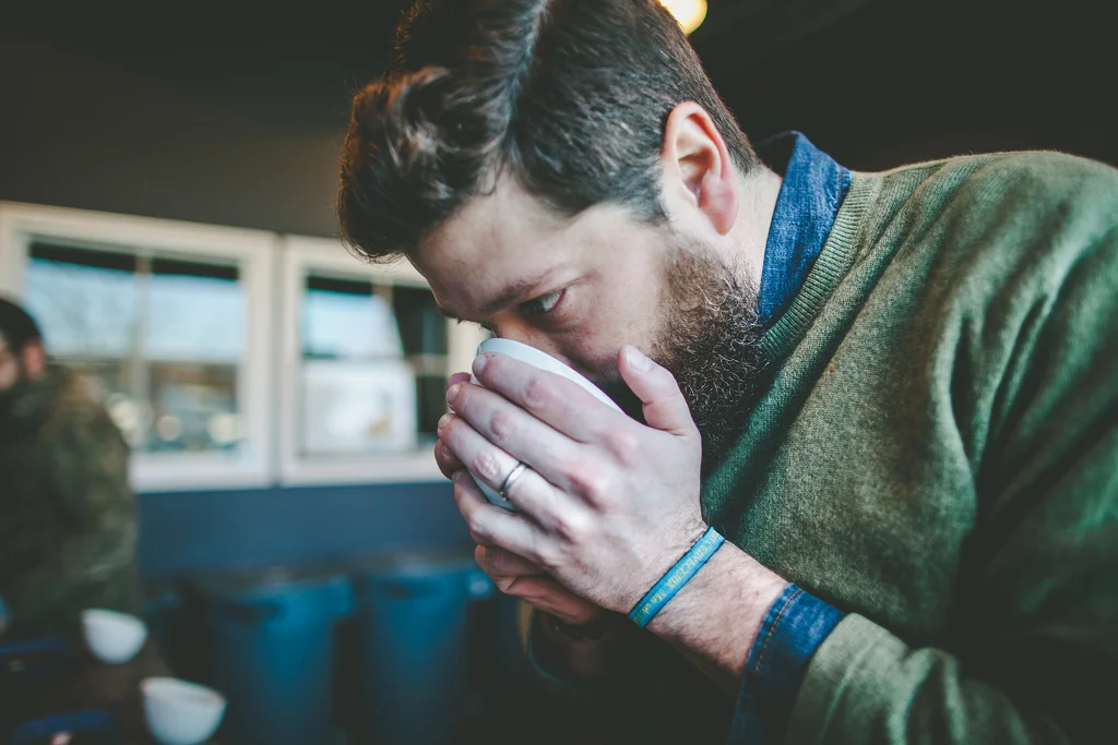  5 Rabbit's Andres Araya gets beard-deep in a bowl of freshly roasted Costa Rican beans.&nbsp; 