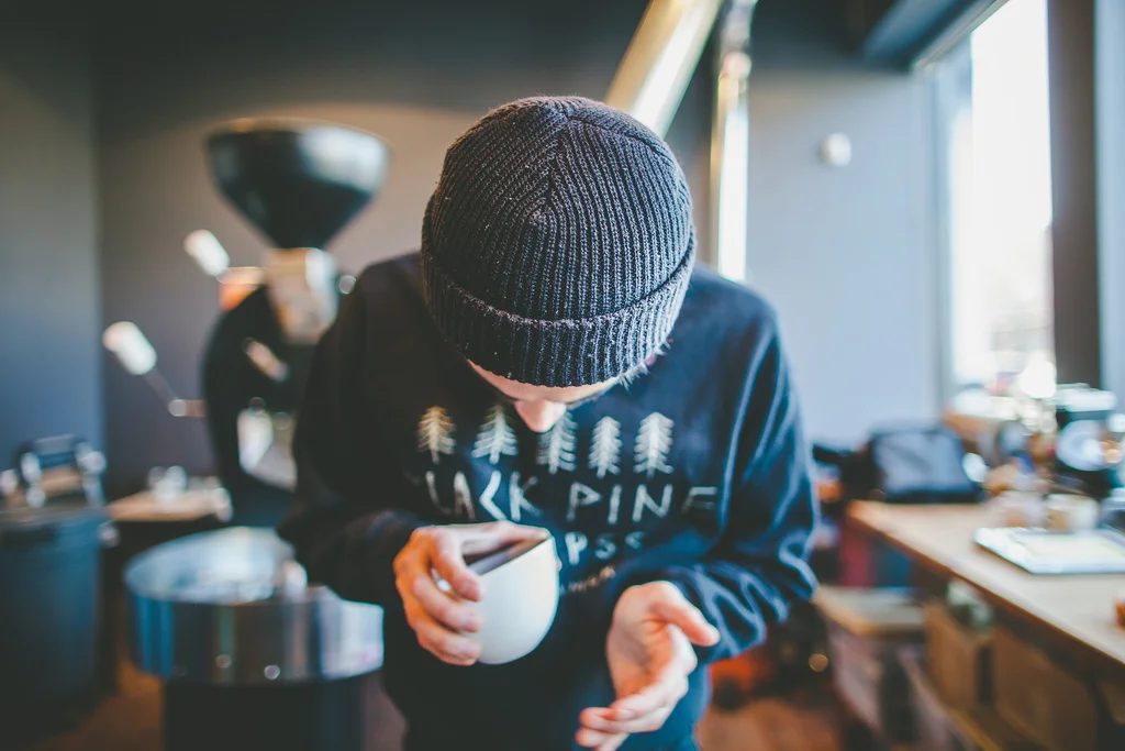  Miro of Gaslight Coffee Roasters shakes the freshly ground beans to liven the aroma.&nbsp; 