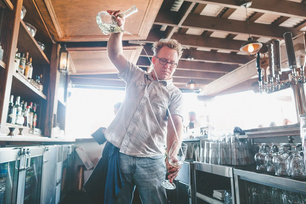 Brian Rutzen pouring a Spanish cider at The Fountainhead