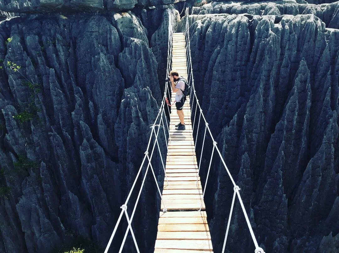 Thomas on an actually-quite-safe-feeling suspension bridge on top of the tsingys.