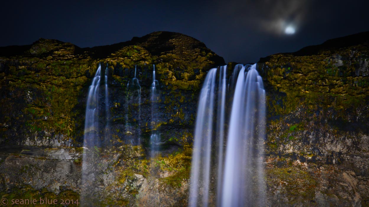 Moonrise over waterfall.
