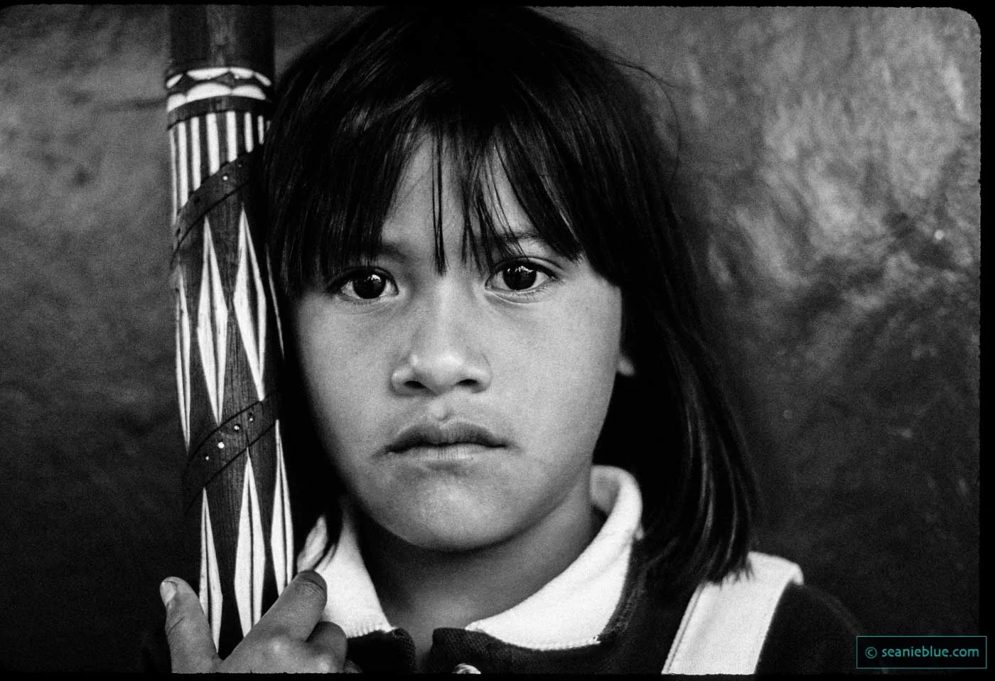 Cax Yum, in Guyana, aged eight. Posing with rainstick.