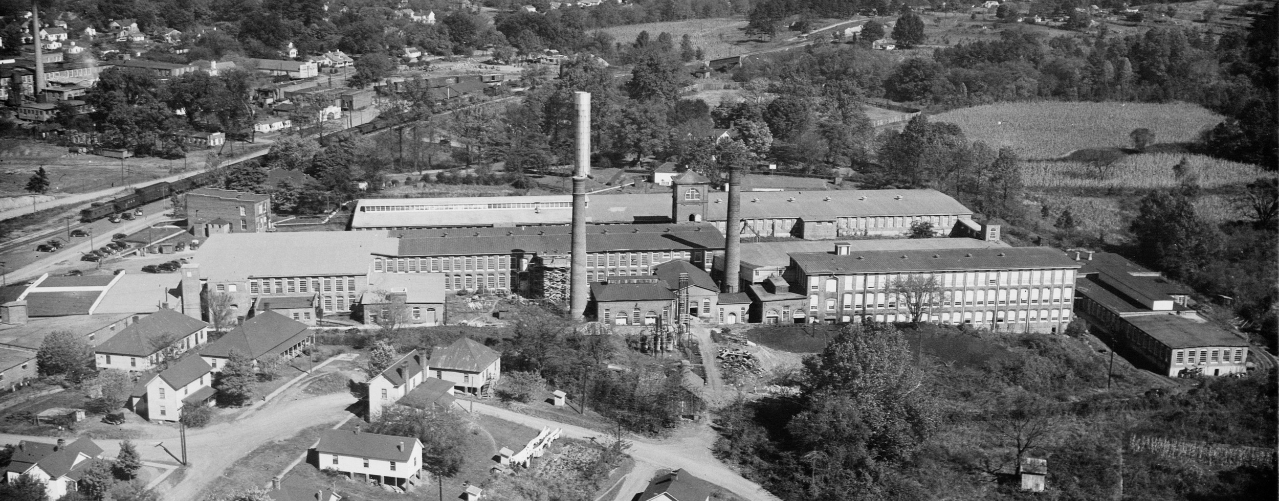 A historical look at The Eno Mill, our new location! &nbsp;The school will be in the shorter building in the far right of the photo.