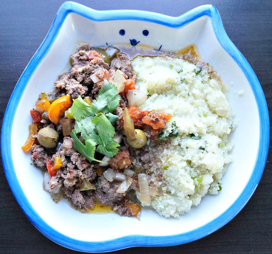 Shown with a side of cauliflower rice and cilantro