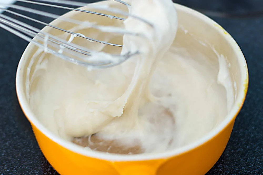 Freshly cooked Legit Cheese, a melted pot of dairy-free cheesy goodness