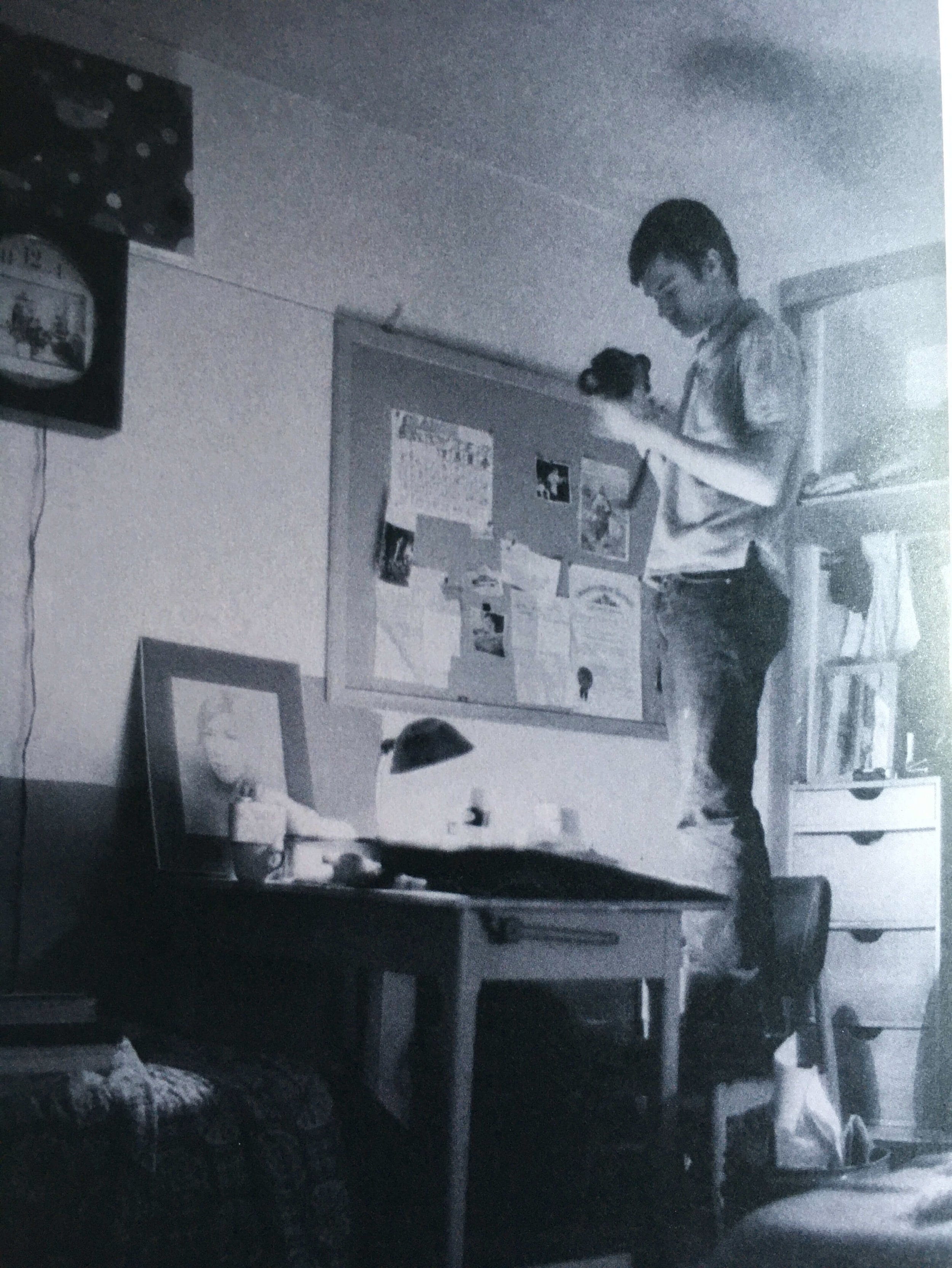 A young Gus Van Sant taking a photo