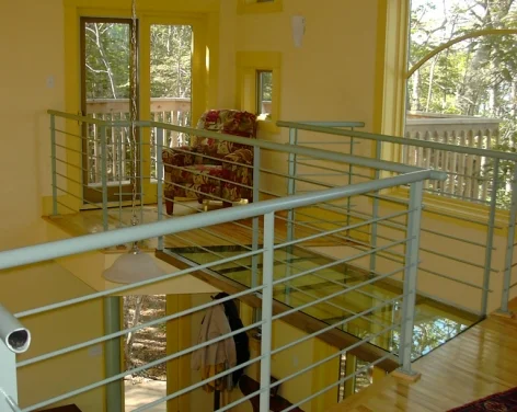  A glass bridge spans to the reading loft and upper deck 