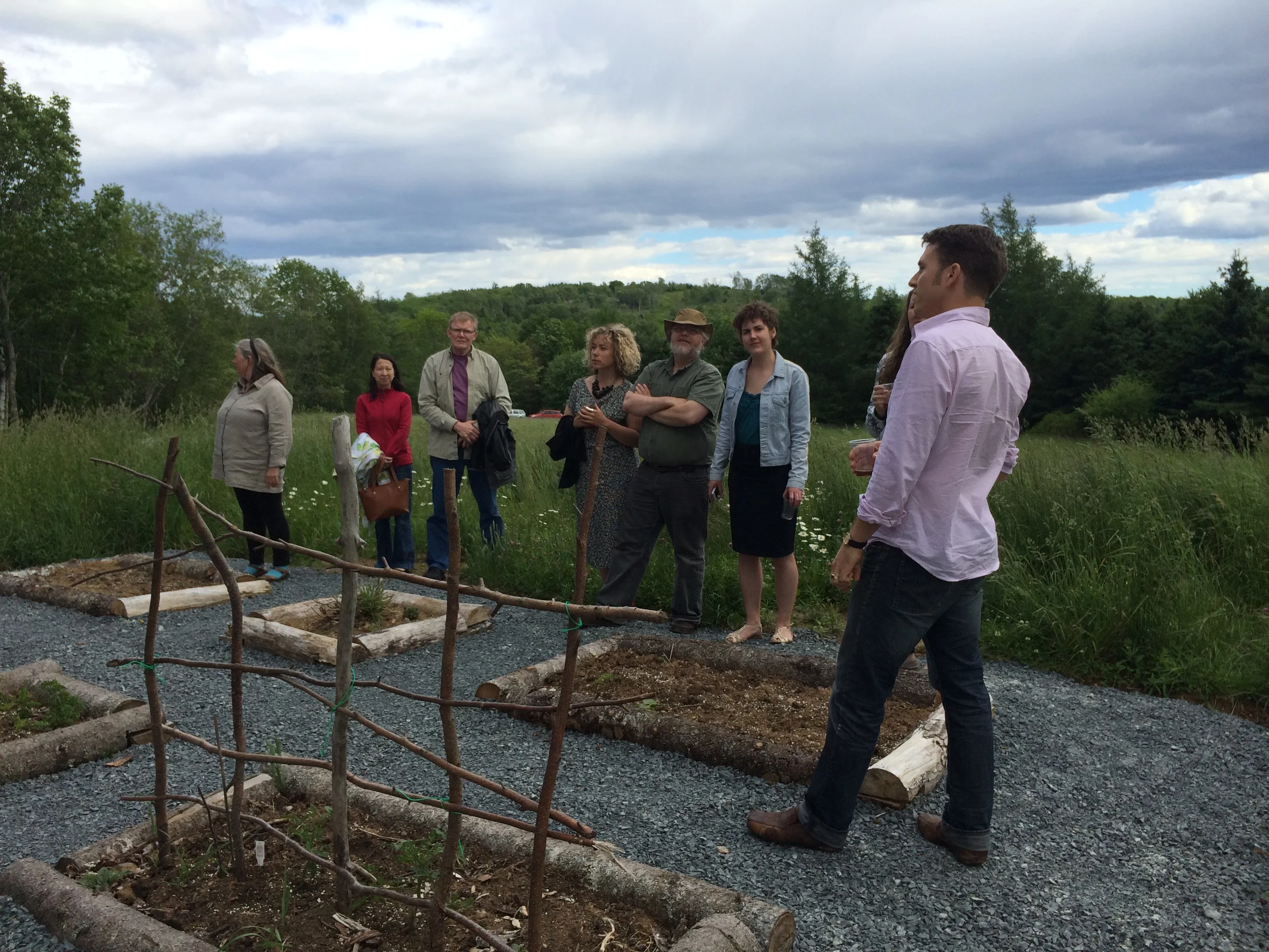 David Gallaugher addressed onlookers amongst the planting beds and field. 