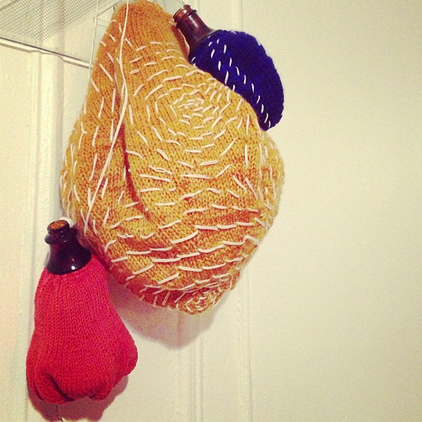 Emma Alpert's knit jugs made with found broken bottle tops.