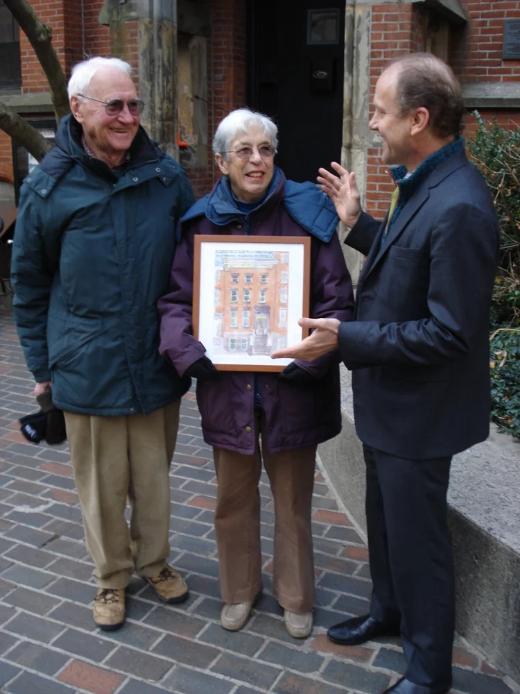 Peter and Camilla Flemming hold their Alfred Award "house portrait" done by Jonathan Marvel, right.