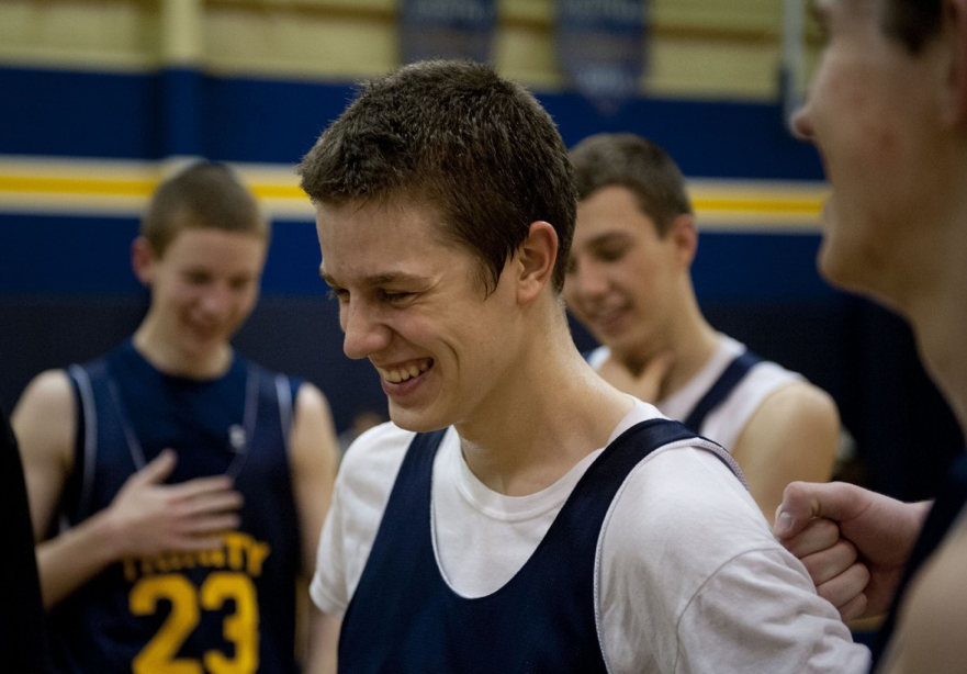 Todd Echtenskamper, a junior, laughs as Christian Kowalski, also a junior, gives him a friendly punch from behind during practice. The team practices most weekday nights and because of it has become really close. Coach Mike Huff said, "I have a great group of guys to work with. The juniors on the team are especially tight though, always sticking together."