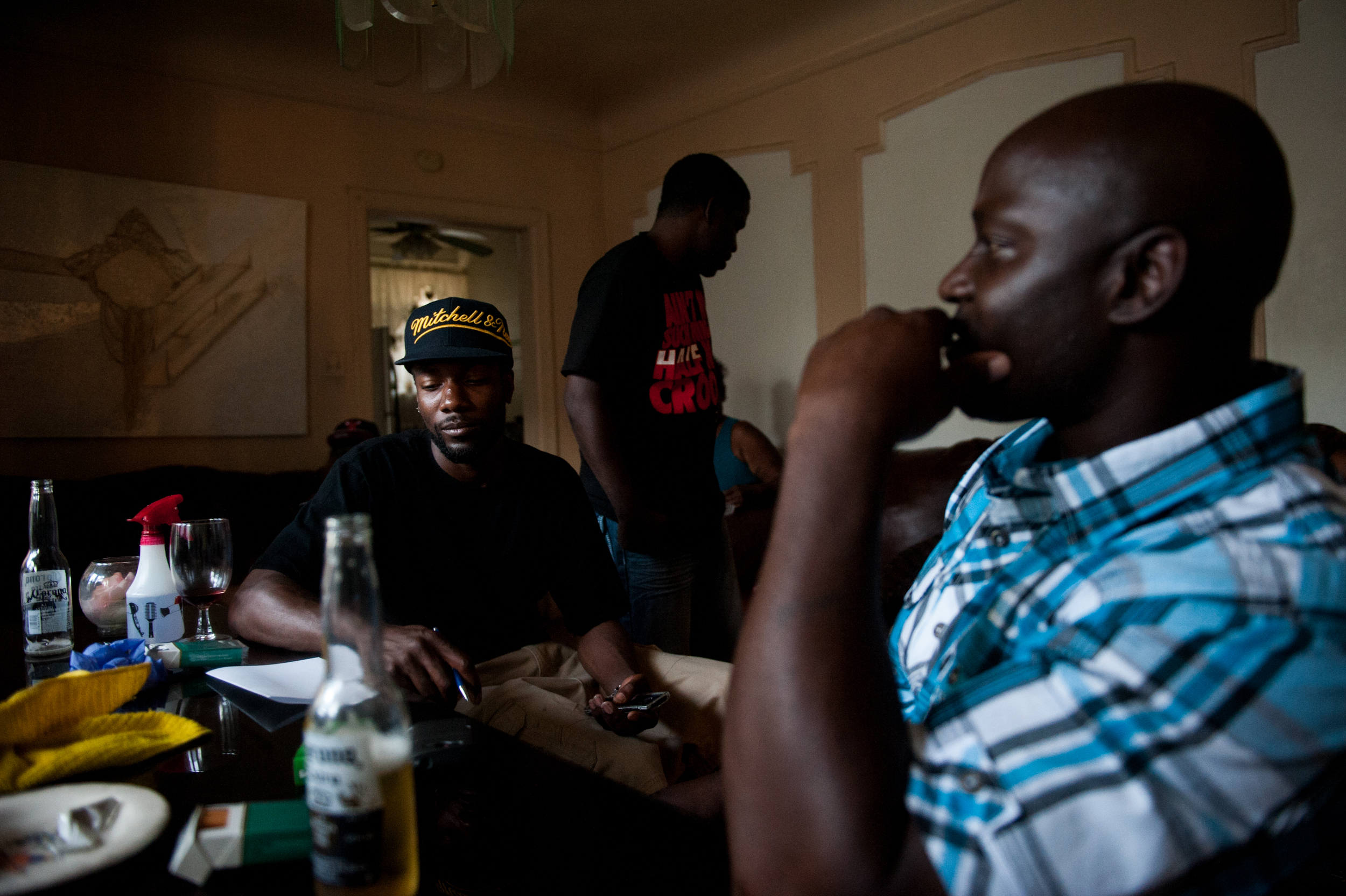  Lee Williams Jr., left, sits quietly with his brother Daniel, right, after meeting him for the first time in their lives. &nbsp;Before Daniel got out of prison, Daniel did not know that he had another brother. &nbsp;Lee is named after their father, 