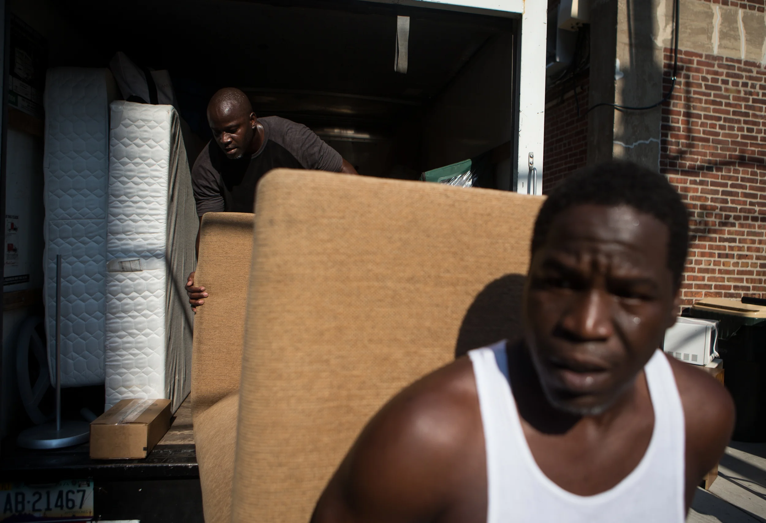  Daniel and David move items into their new apartment in Evanston, IL on July 22, 2013. &nbsp;Many of their belongings came from Margaret Rosetta, who had also been incarcerated. &nbsp;She had died a week prior to Daniel's move, but left all of her b