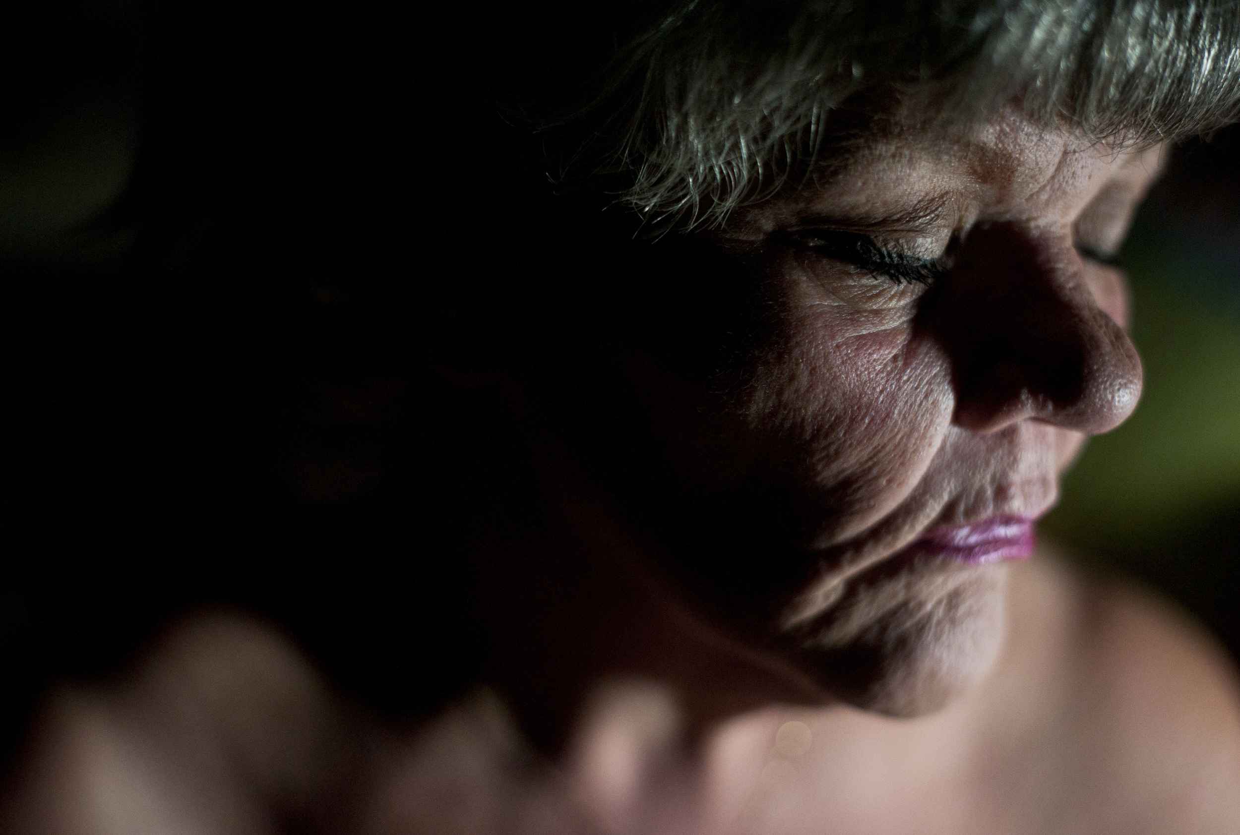  Mary sits quietly on her bed after a long day with the children.&nbsp; Because they were out of school for the holidays, Mary's work had suddenly become a daily twenty-four hour struggle.&nbsp; "I'm just exhausted, I'm totally drained," she said.&nb