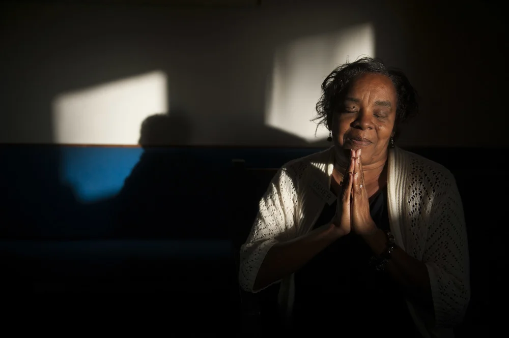  Deborah Barr, 56, sits for a portrait after service at the Israel Bethel P.B. Church in Tampa on Sunday, November 17, 2013. &nbsp;Barr, who is unable to read, carries a bible in her purse and is hoping to one day be able to read it. &nbsp;Her story 