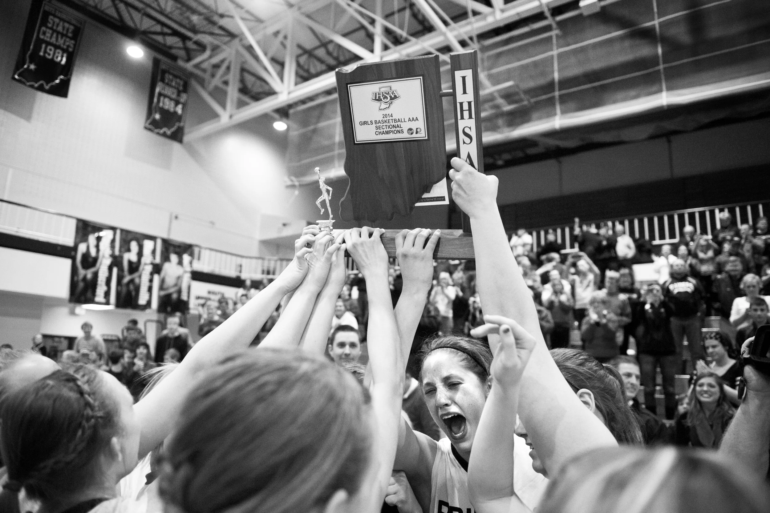 The Southridge Raiders hoisted their trophy up after winning the Class 3A girls basketball sectional championship at Alice Arena in Vincennes on Saturday. Southridge defeated Vincennes 46-41. 