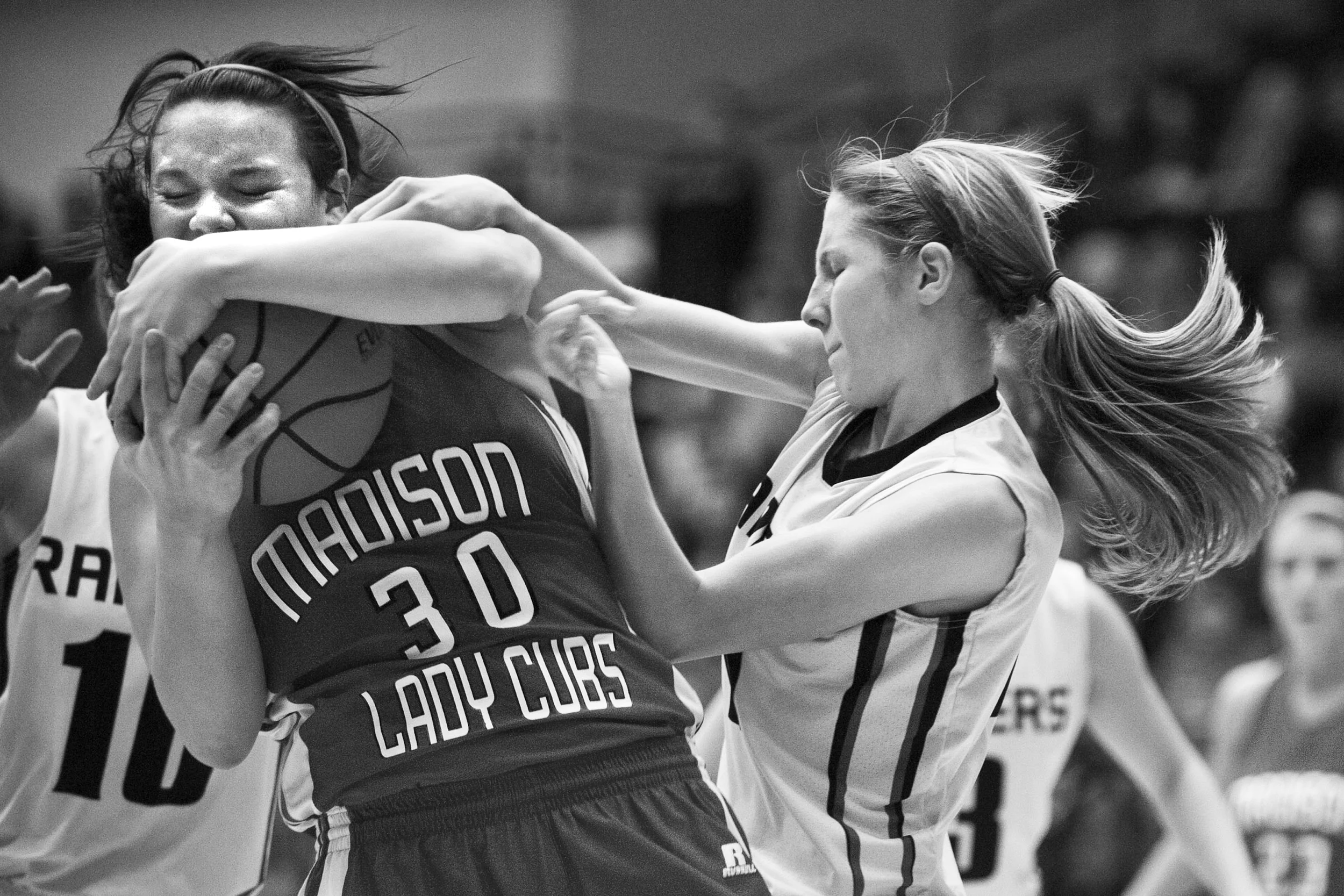 Southridge's Aubrey Main fought for the ball after Madison's Macky Hecox intercepted it during the IHSAA girls basketball regional championship in Jasper on Saturday. Madison defeated Southridge 66-51.