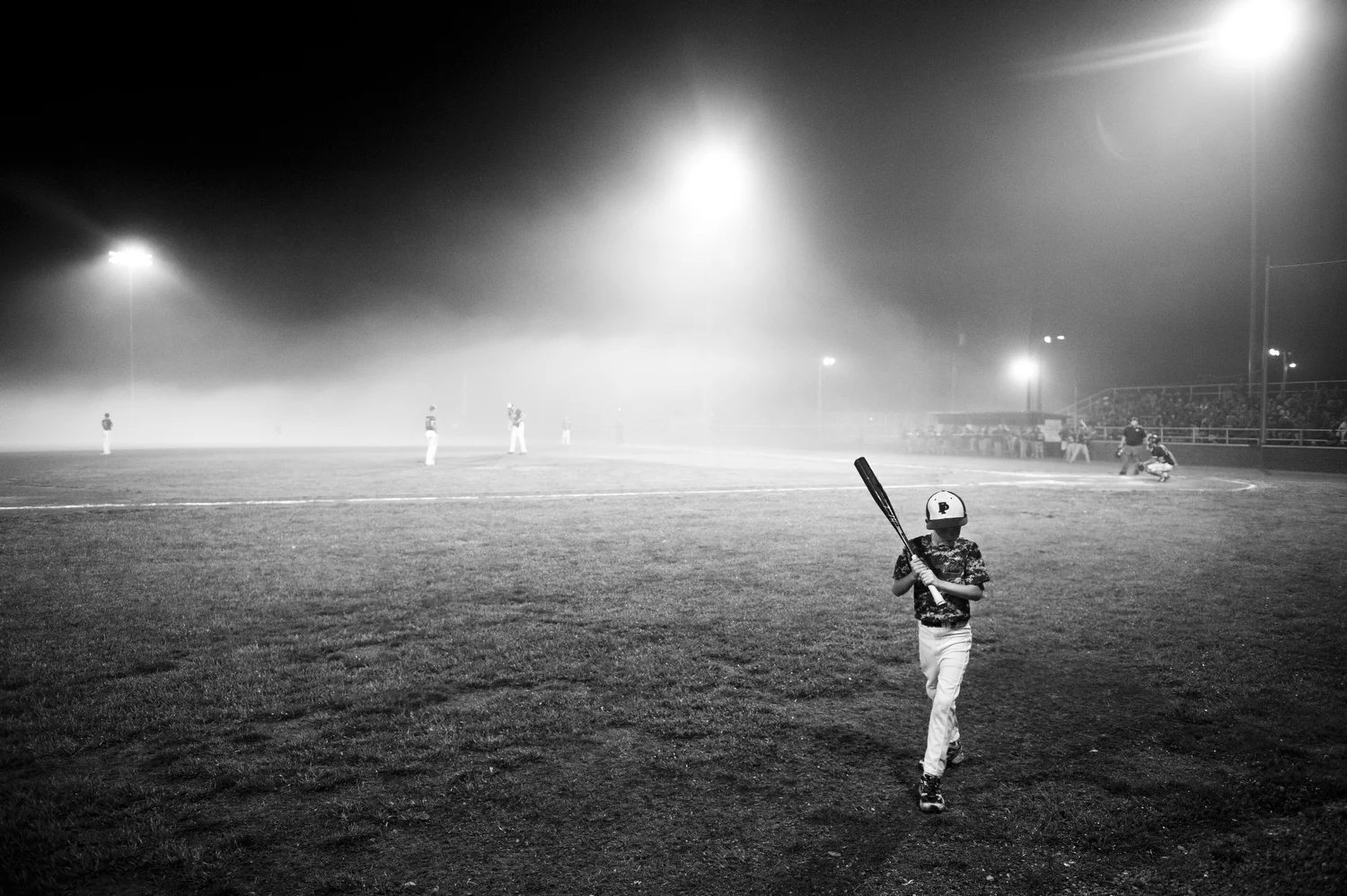  Reid Howard of Ferdinand, 8, walked a bat back to the dugout during the Class 2A sectional game in Tell City, IN on May 30, 2014.&nbsp; Forest Park was defeated by South Spencer 9-2. 