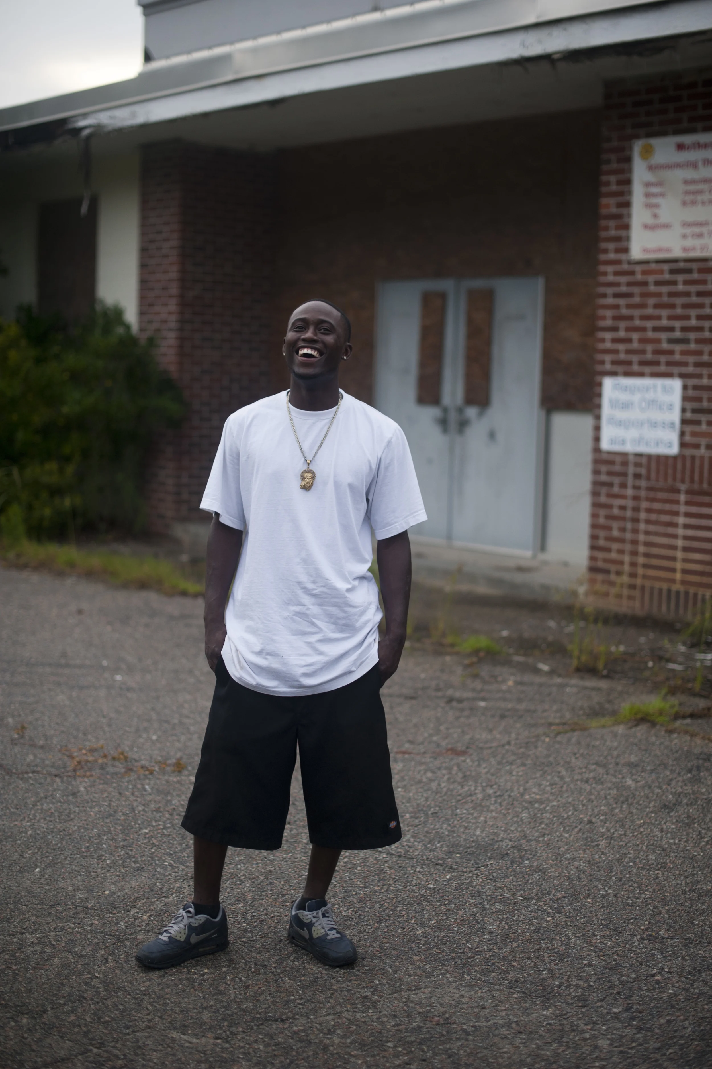  Roosevelt Brown, 23, stands for a portrait in front of the old West Hardeeville School building in Hardeeville, SC on Saturday, July 19, 2014. &nbsp;He graduated from the school in 2005, when the building was still being used. &nbsp;His mother is a 