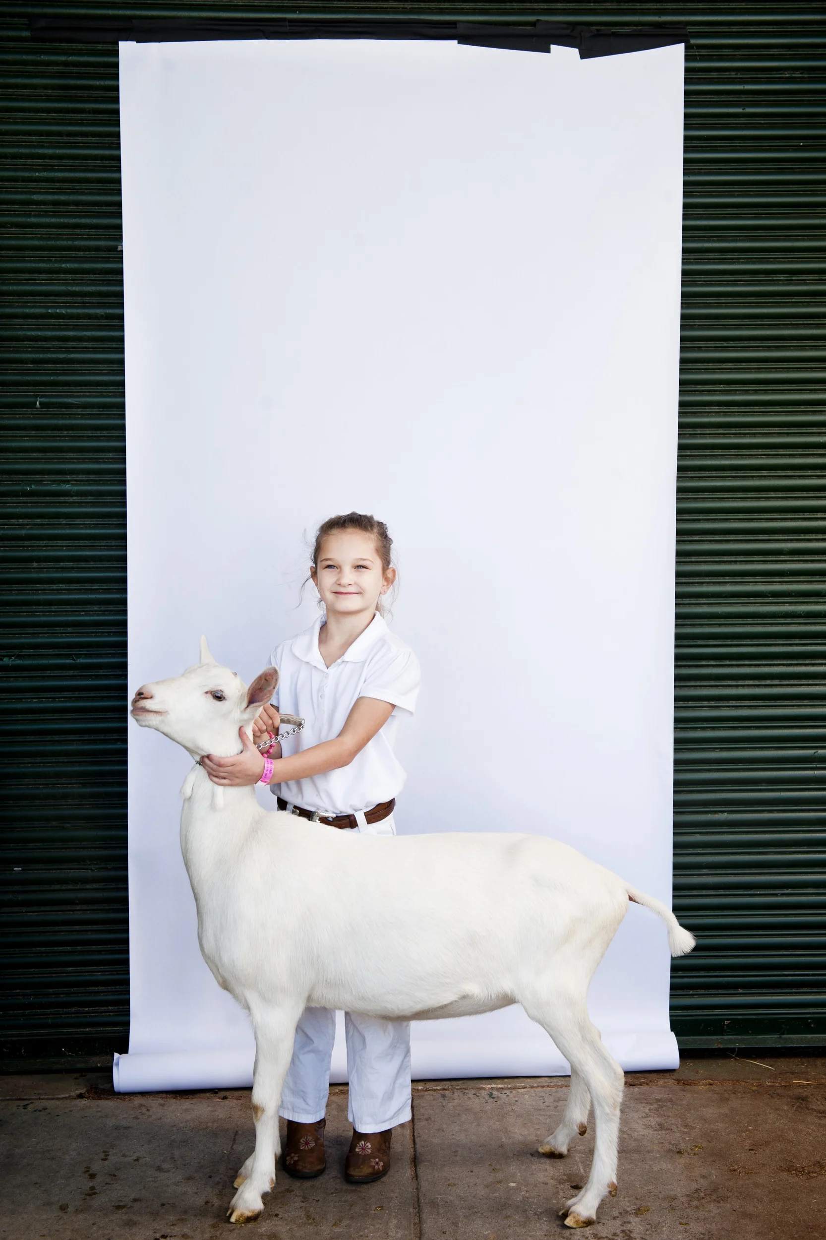  Grace Moore, 6, and Paper Moon stand&nbsp;for a portrait&nbsp;at the North Carolina State Fair on October 25, 2013. 