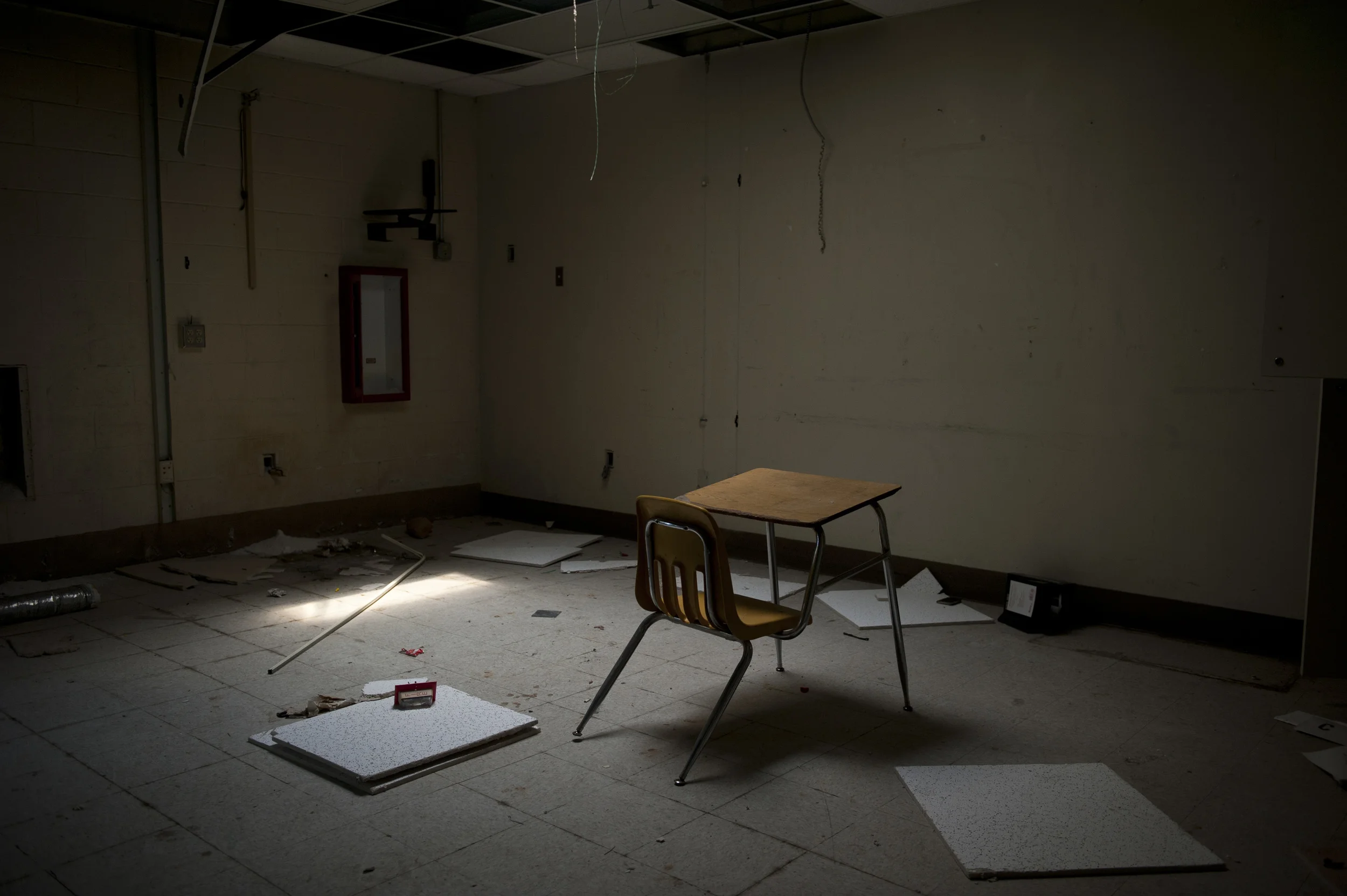 An abandoned school desk sits in a classroom inside the old Ridgeland Middle School building in Ridgeland, S.C. on Wednesday, July 30, 2014. Up until the desegregation of schools, the building only housed classes for the minority students in the county. Now the district is planning on restoring the building to use for office space and community programs. Photographed for Al Jazeera America. 