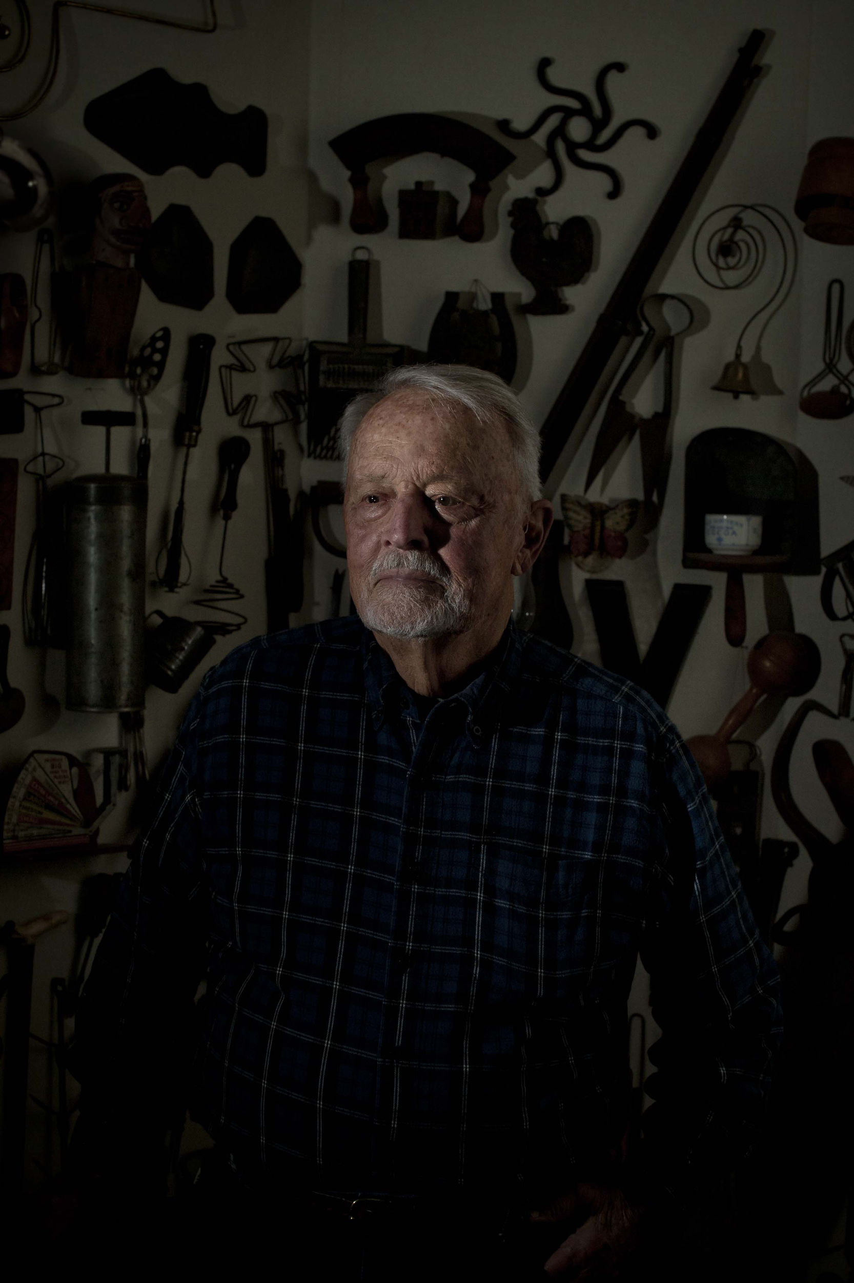 Louis Van Houten, my grandfather, stands for a portrait in front of his antique collection in Sherwood Forest, MD. The antiques have been arranged that way on the wall for 24 years. 