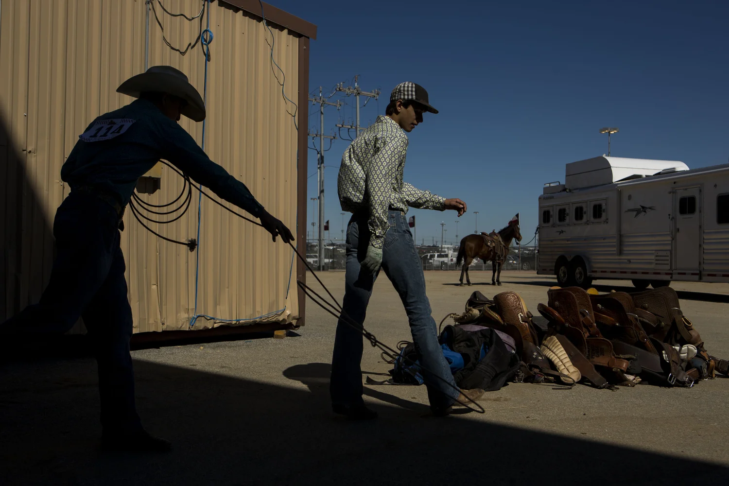 Cash Fretwell practices roping on his friend Brice Bauer's feet at the San Antonio Stock Show and Rodeo in San Antonio, TX on Wednesday, February 18, 2015. They both are 14 and from Pleasanton, TX. 