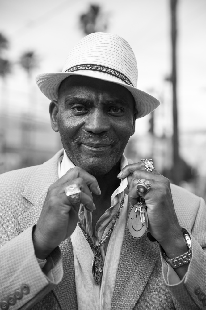 Spanky Lee stands for a portrait in the Mission neighborhood of San Francisco, Calif. on June 2, 2015. Originally from Memphis, Lee said that he works as a pimp to pay the rent on his apartment in the neighborhood. He pays $800 a month for a small rent-controlled apartment in the Mission. "I wouldn't trade my apartment for a place in heaven," he said. "I have lived here for years. I didn't like it at first, but this is the coolest spot in San Francisco. However, now they are starting to tear down the art."